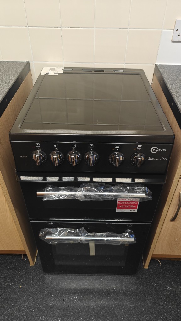 Black Flavel Milano E50 double oven electric cooker installed in a kitchen